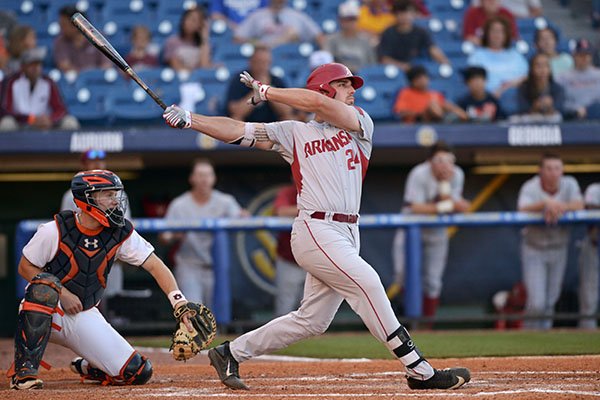 Arkansas first baseman Chad Spanberger hits a home run during a game against Auburn on Thursday, May 25, 2017, at the SEC Tournament in Hoover, Ala.	