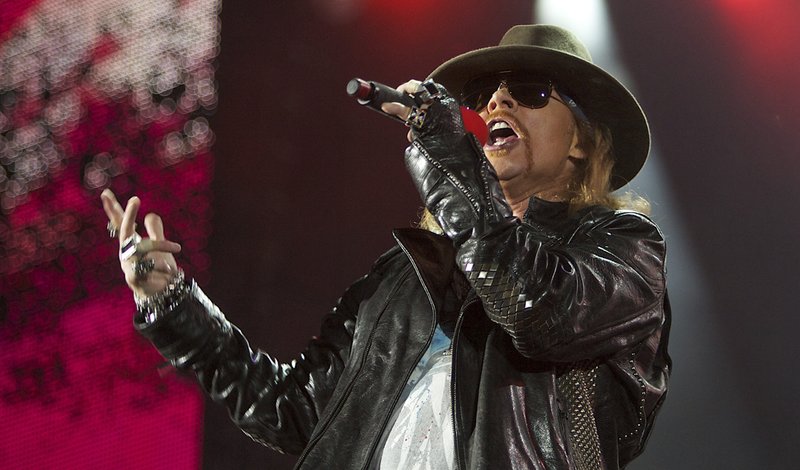 FILE - In this Dec. 16, 2010 file photo, Axl Rose, lead singer of the rock band, "Guns N' Roses, " performs during a concert on the Yas Island in Abu Dhabi, United Arab Emirates. (AP Photo/Nousha Salimi, file)
