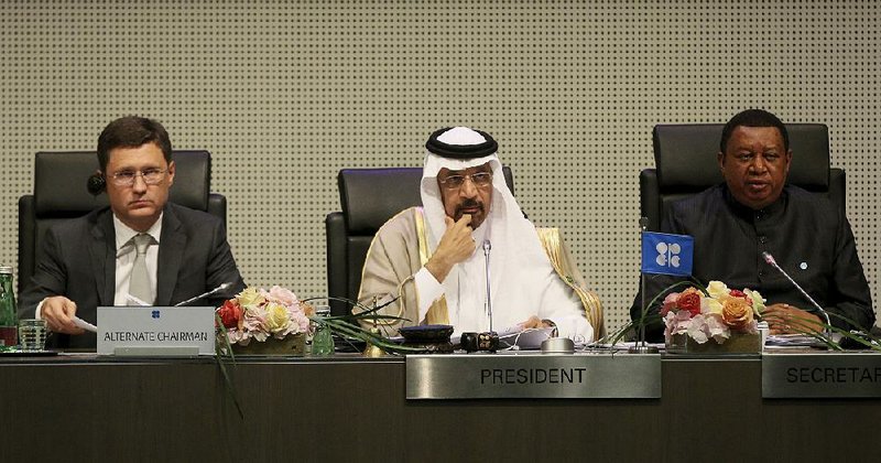 Russian Minister of Energy Alexander Novak (from left), Khalid al-Falih, Saudi Arabia’s minister of energy, industry and mineral resources, and OPEC Secretary-General Mohammad Sanusi Barkindo of Nigeria wait Thursday for the start of an OPEC meeting in Vienna. 