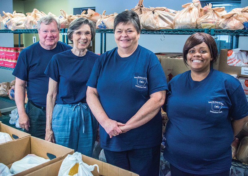 John Peek, from left, Nona Floyd, Beverly Sellers and Shenell Green volunteer at Batesville Help and Hope. Peek became the facility’s director of operations in March.
