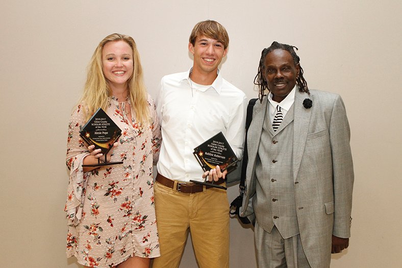 Terrance Armstard/News-Times The Scholar-Athletes of the Year were, from left, Alexie Pope of El Dorado and Robbie Roberson of Junction City, pictured with guest speaker Rance Olison.