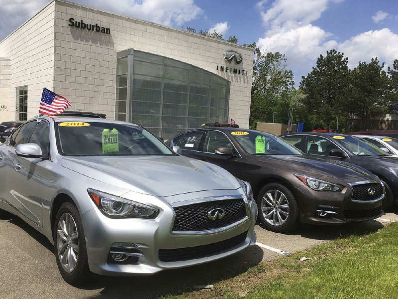 Used Infiniti Q50 luxury sedans await buyers at a dealership in the Detroit suburb of Novi, Mich., earlier this month. As more leases end, high-quality used cars are flooding the market. 