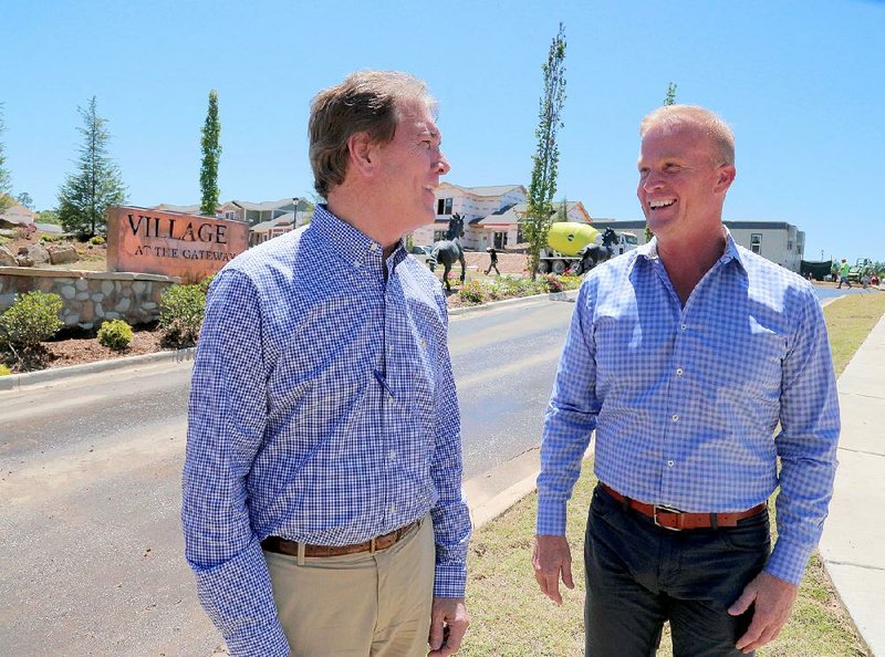 Bob Francis (left) and Russ Huckaby are the principals behind Village at The Gateway, a 38-acre development going up alongside the retail and entertainment district at the Interstate 430/Interstate 30 interchange in Little Rock. 
