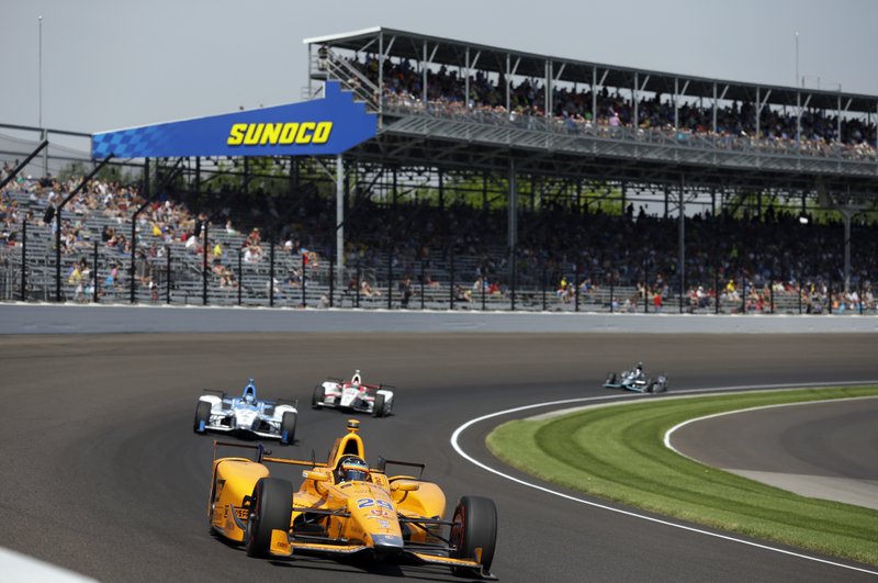Fernando Alonso, of Spain, drives through the first turn during the final practice session for the Indianapolis 500 IndyCar auto race at Indianapolis Motor Speedway, Friday, May 26, 2017 in Indianapolis. (AP Photo/Michael Conroy)