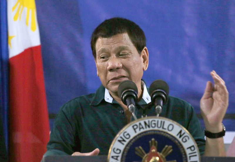 Philippine President Rodrigo Duterte addresses troops during his visit to the 2nd Mechanized Brigade Friday, May 26, 2017 on the outskirts of Iligan city in southern Philippines. Duterte told the troops fighting Muslim militants for the control of southern Marawi city to use martial law powers to defeat the Islamic State group-linked extremists. (AP Photo/Bullit Marquez)
