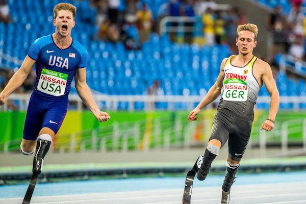 Johannes Floores (right) of Germany and Hunter Woodhall (left) of USA react after the Final Men's 4x100m Relay during the Rio 2016 Paralympic Games in Rio de Janeiro, Brazil, on Monday, Sept. 12, 2016. (Jens Büttner/AP Images)