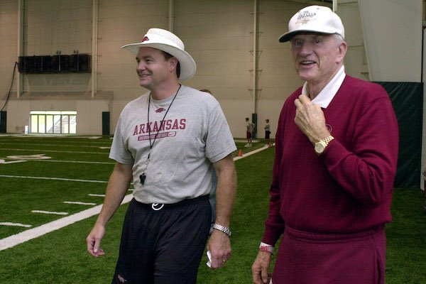 Arkansas head football coach Houston Nutt, left, laughs with athletic director Frank Broyles during freshman practice at the Walker Pavilion in Fayetteville, Ark., in this Aug. 13, 2002 file photo. (AP Photo/April L. Brown, File)