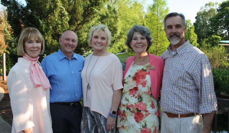NWA Democrat-Gazette/CARIN SCHOPPMEYER Linda McMath, Botanical Garden of the Ozarks board president (from left), Jay and Judy McDonald, honorary Greening of the Garden chairmen, Charlotte Taylor, executive director, and Tim Hudson welcome guests to the fundraiser May 9 at the garden in Fayetteville.