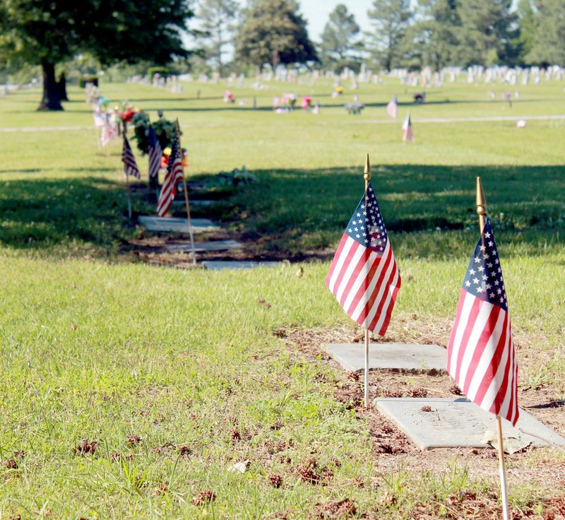 Michael Burchfiel/Siloam Sunday Flags were placed at the graves of nearly 700 veterans at Oak Hill Cemetery.