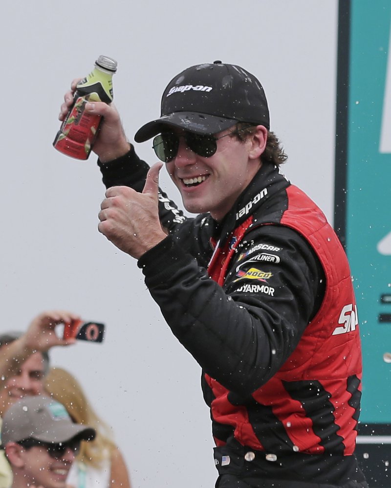 Ryan Blaney celebrates in Victory Lane after winning the NASCAR Xfinity series auto race at Charlotte Motor Speedway in Concord, N.C., Saturday, May 27, 2017. (AP Photo/Chuck Burton)