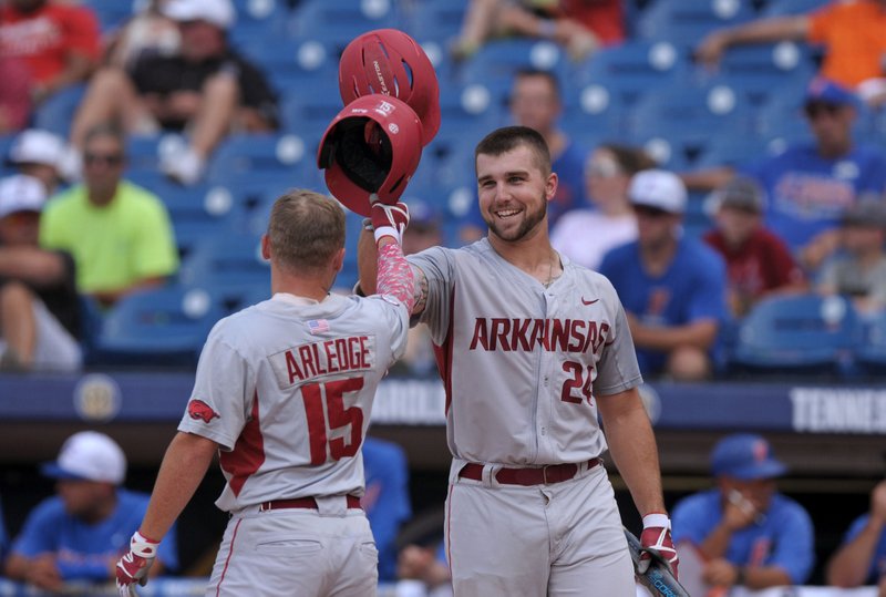 Arkansas’ Chad Spanberger (right) hit two home runs in the Razorbacks’ 16-0 victory over Florida on Saturday at the SEC Tournament, giving him five for the tournament. The Razorbacks face LSU today in the championship game. 