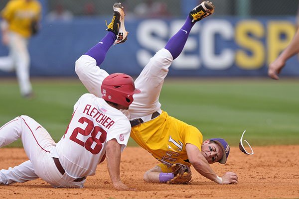 Arkansas outfielder Dominic Fletcher (28) slides into LSU second baseman Cole Freeman during an SEC Tournament game on Sunday, May 28, 2017, in Hoover, Ala. 