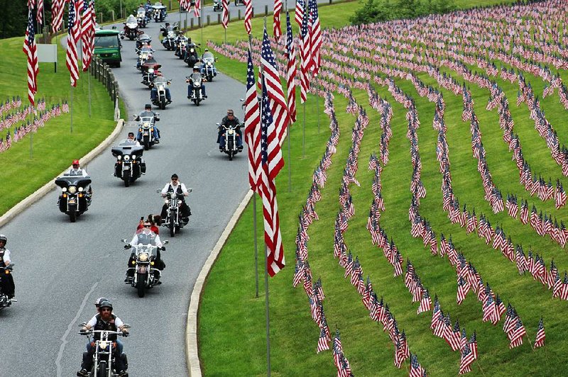 Motorcyclists on Saturday ride into Indiantown Gap National Cemetery in Annville, Pa., for a Memorial Day weekend service. 