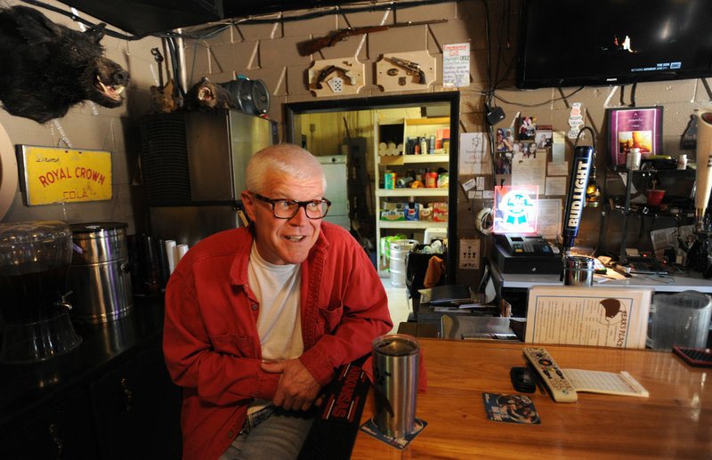 Barry “Bear” Bramlett, owner of Bear’s Place on 15th Street in Fayetteville, speaks Thursday at the end of the bar in his bar and restaurant in south Fayetteville that features live music most nights since opening in 2012.