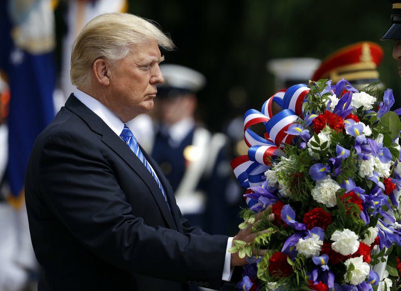 President Donald Trump lays a wreath at The Tomb of the Unknown Solider at Arlington National Cemetery, Monday, May 29, 2017, in Arlington, Va.