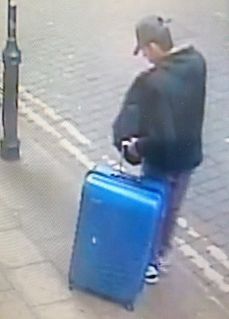 This is a handout photo taken on Monday, May 22, 2017 from CCTV and issued on Monday, May 29, 2017 by Greater Manchester Police of Salman Abedi in an unknown location of the city centre in Manchester, England. The police released an image of the bomber carrying a distinctive blue suitcase and an image of a replica of the case as they appealed for information about his final days. 