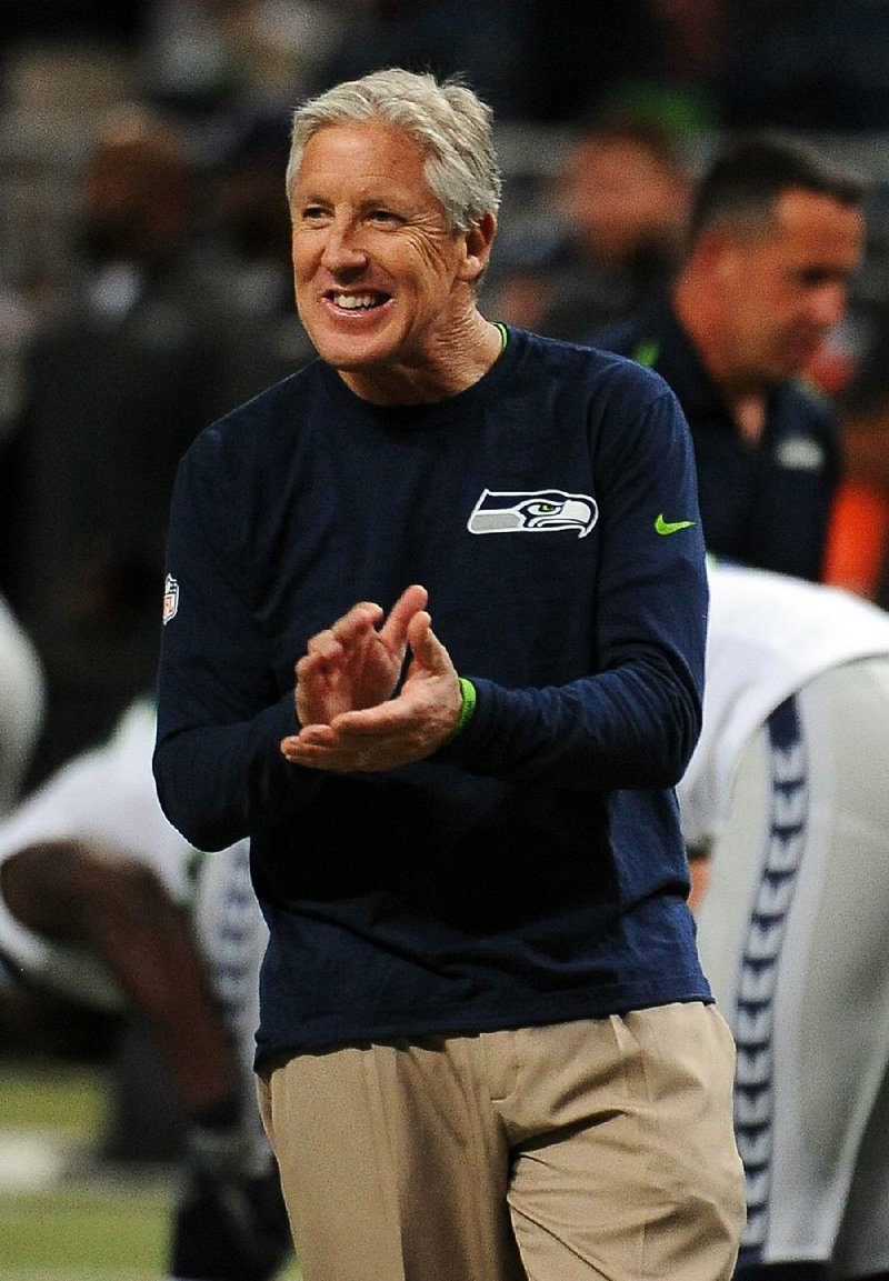 Seattle Seahawks head coach Pete Carroll roams the field before the start of an NFL football game between the St. Louis Rams and the Seattle Seahawks Sunday, Oct. 19, 2014, in St. Louis. 