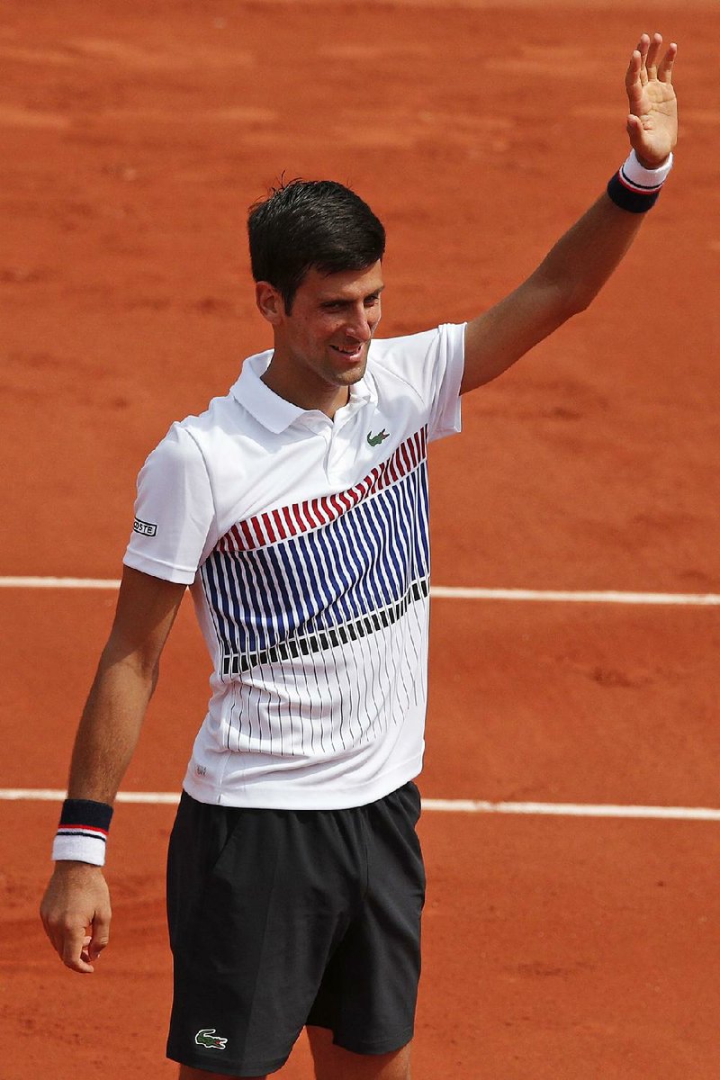Serbia's Novak Djokovic celebrateS his three set win, 6-3, 6-4, 6-2, over Spain's Marcel Granollers in the first round match of the French Open tennis tournament at the Roland Garros stadium, in Paris, France. Monday, May 29, 2017. 