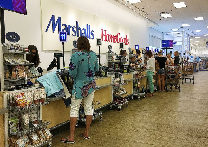 Shoppers, like these at a Marshalls and HomeGoods store in Phoenix earlier this year, helped consumer spending rise last month.