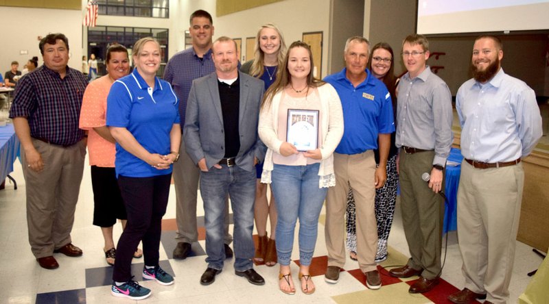 Photo by Mike Eckels Cameron Shaffer (center, right) received the 2017 female athlete of the year award during the Decatur Athletic Banquet at Decatur Northside Elementary May 24. Surrounding Shaffer is the Decatur coaching staff which included James Garner (back row, left), Lisa Barrett, Jason Porter, Ashley Riggles, and Ladale Clayton, (front row, left) Jessi Castagna, Adam Vore, Shaffer, Shane Holland, John Unger, and Jeff Melton.