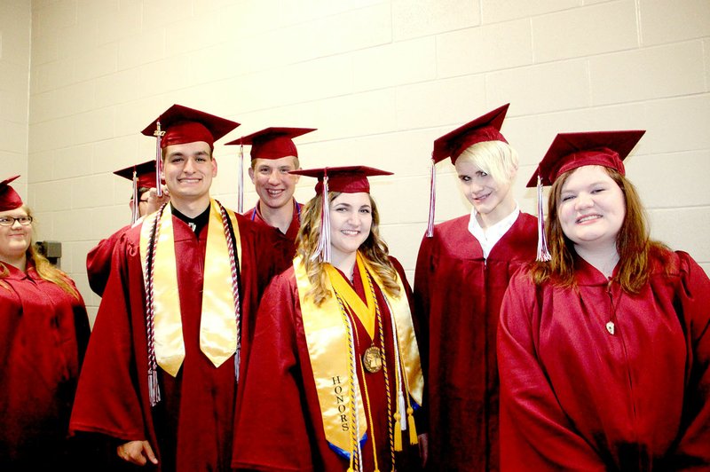 Graduates Joseph Chavana, left, Brent Coggins, Lauren Cole, Gage Colvin and Selora Collins wait in the hallway for the 2017 Commencement ceremony to begin. Lincoln High School graduated 96 seniors.