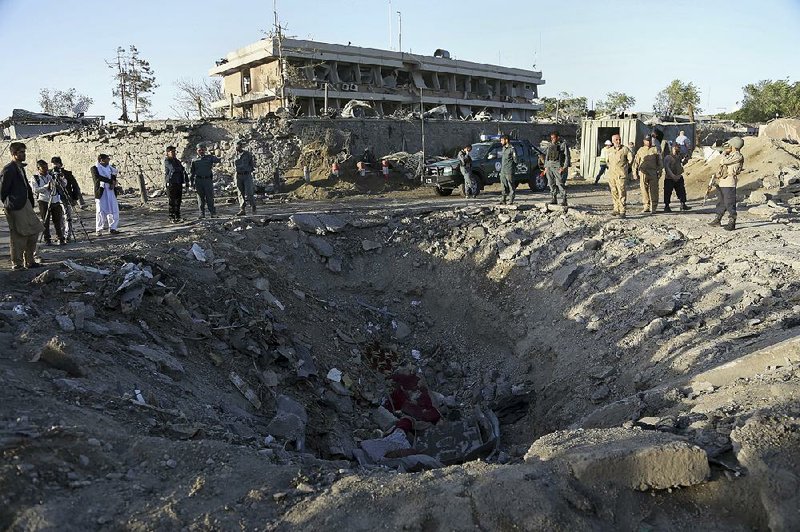 Wednesday’s truck bomb explosion created this crater in a fortiÿed area of Kabul, Afghanistan, near several foreign embassies.