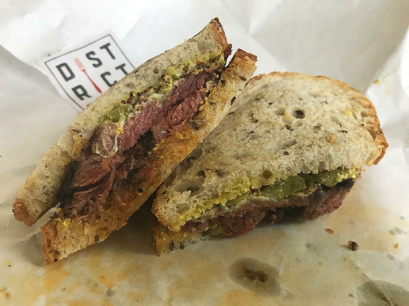 The Pastrami sandwich at District Fare is successful for many reasons, but mainly for its luscious, juicy pastrami. 