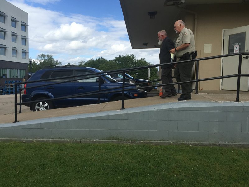 NWA Democrat-Gazette/TRACY M. NEAL Ronald Lewis, 67, of Pineville, Mo., is escorted Wednesday by a Benton County Sheriff&#8217;s Office deputy after being sentenced in Bentonville to 50 years in prison. A jury found him guilty of rape and two counts of sexual assault in the second degree involving two boys.