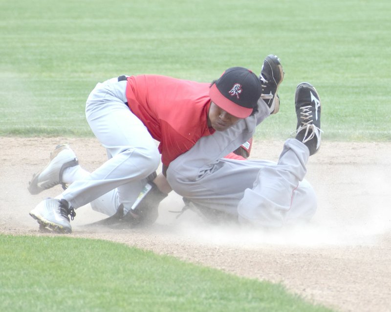 Photo by Rick Peck McDonald County shortstop Trent Alik tags out a Carl Junction runner attempting to steal second base during McDonald County&#8217;s 9-8 win on May 26 in the Carl Junction 16U Baseball Tournament.