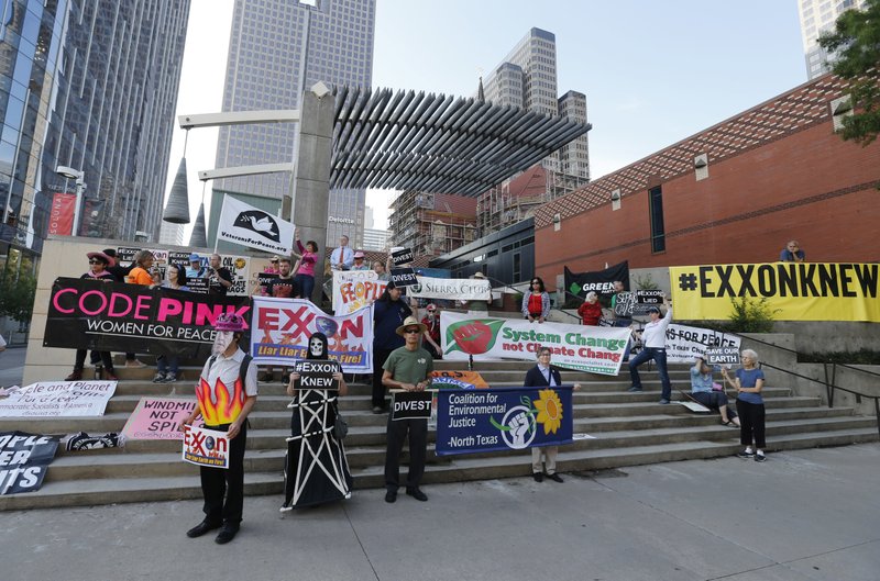 Protesters gather outside of the Exxon shareholders meeting across the street from Morton H. Meyerson Symphony Center in Dallas on Wednesday, May 31, 2017.  