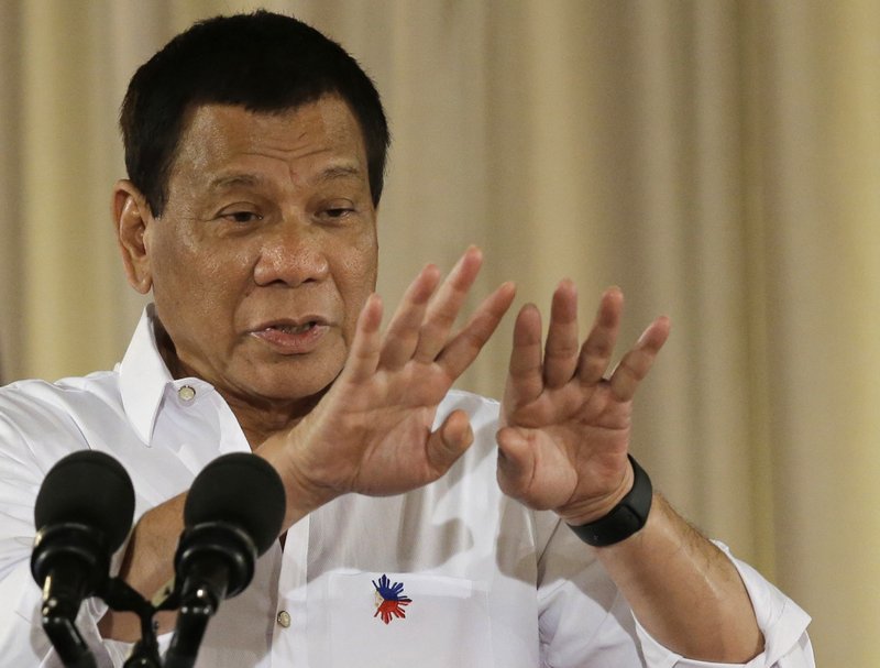 In this Thursday, June 1, 2017 photo, Philippine President Rodrigo Duterte gestures during his speech at a swearing in ceremony of officials of various municipalities at the Malacanang presidential palace in Manila, Philippines. The Philippine president says he won't talk to militants aligned with the Islamic State group and has ordered troops to kill them even if the gunmen slaughter their hostages in a besieged southern city. 