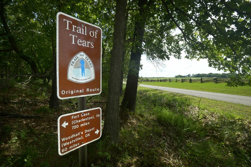 A sign marks the historic route of the Trail of Tears Friday as it passes through Pea Ridge National Military Park. The National Park Service and Trail of Tears Association are working to add more signs for Trail of Tears sites throughout Benton and Washington counties, including a third such sign at Pea Ridge National Military Park to be installed later this month.