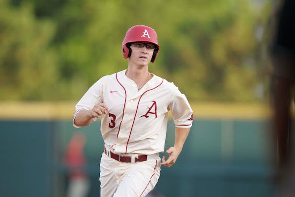 Missouri State players Jake Burger, left, Jordan Knuston celebrate after  beating Arkansas, 3-2, during an NCAA college baseball regional tournament  game, Monday, June 5, 2017, in Fayetteville, Ark. The win advances Missouri