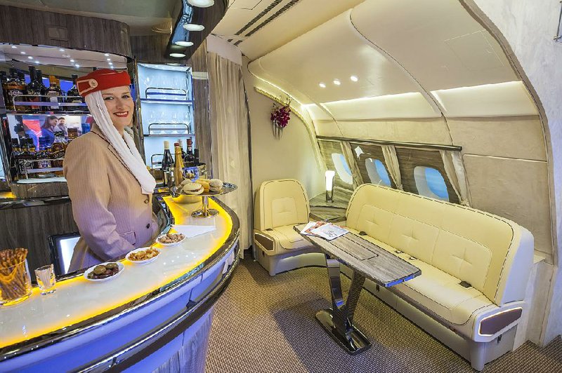 The bar of an Emirates Airlines’ Airbus A380 was on display at the ITB Travel Fair in Berlin in March. An Airbus official said Monday that the company plans to slow production of the superjumbo jet to ride out “a period of softness in the market for large aircraft.” 