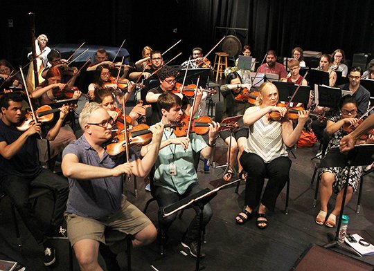 The Sentinel-Record/Richard Rasmussen REHEARSAL: Members of the Hot Springs Music Festival Symphony Orchestra rehearse on Monday at Oaklawn Magnet School. The 22nd season of the music festival opened Sunday with its traditional Brass Fanfare at the Arlington Resort Hotel & Spa, followed by a Mentor Showcase.