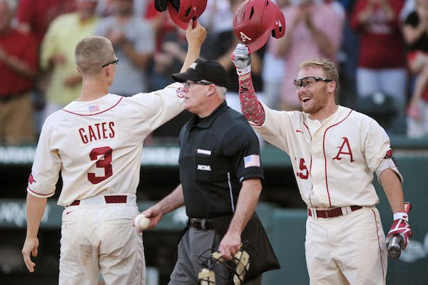 Jake Arledge (right), Arkansas left fielder, celebrates as Jared Gates, Arkansas third baseman, returns from a solo home run in the 5th inning against Missouri State Monday, June 5, 2017, during the final game of the NCAA Fayetteville Regional at Baum Stadium in Fayetteville.