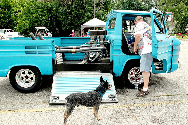 PHOTOS BY LYNN KUTTER ENTERPRISE-LEADER Cyclone Cox, of Greenland, brought his dog Blu, a minature blue heeler, and his 1962 Corvair 95 Rampside to the Cardinal Car Classic on Saturday. The vehicle gets its name from the side ramp.