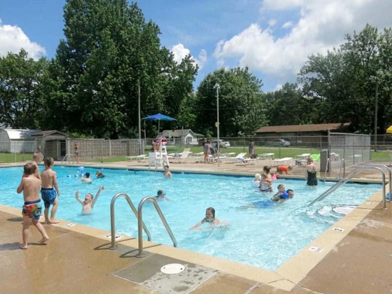 Photo by Susan Holland Lifeguard Cameron Shaffer was on duty at the Gravette swimming pool Friday, June 2, supervising a number of swimmers enjoying the refreshing waters. Youngsters of all ages and a few parents were taking a dip. Open hours for the pool are 10 a.m. to 6 p.m. Monday through Saturday.
