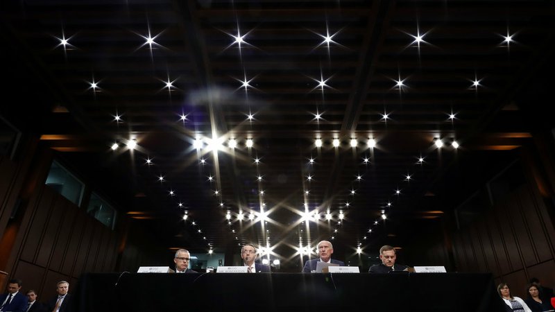 From left, Acting FBI Director Andrew McCabe, Deputy Attorney General Rod Rosenstein, National Intelligence Director Dan Coats, and National Security Agency Director Adm. Michael Rogers are seated during a Senate Intelligence Committee hearing about the Foreign Intelligence Surveillance Act on Capitol Hill on Wednesday, June 7, 2017, in Washington. 