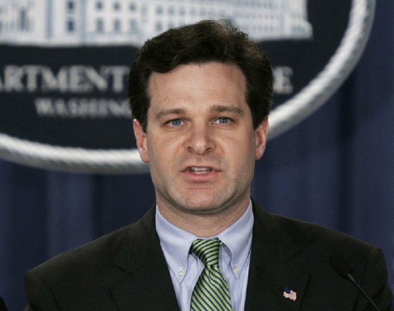 In this Jan. 12, 2005 file photo, Christopher Wray speaks at a press conference at the Justice Dept. in Washington.  President Donald Trump has picked the longtime lawyer and former Justice Department official to be the next FBI director. 