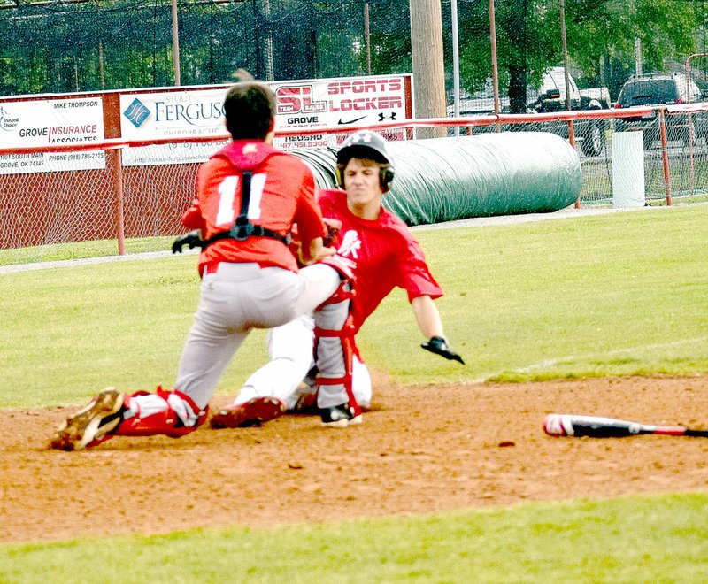 Photo by Rick Peck McDonald County&#x2019;s Koby McAlister gets tagged out trying to score a run in McDonald County&#x2019;s 17-7 win over Oklahoma Broncos on June 4 in the fifth place game of the Grove 16U Baseball Tournament.