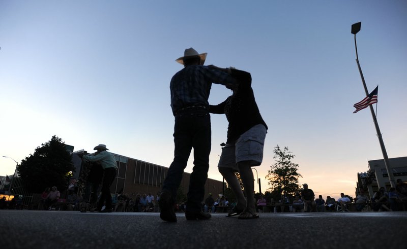 File photo/NWA Democrat-Gazette/ANDY SHUPE  Couples sway to the music during the 2016 Western Days Street Dance on Emma Avenue in Springdale. The free Street Dance starts at 8 p.m. June 17 on Emma Avenue in dowtown Springdale, featuring the Boston Mountain Playboys. Rodeo of the Ozarks, a PRCA rodeo, runs June 21-24 at Parsons Stadium in Springdale.