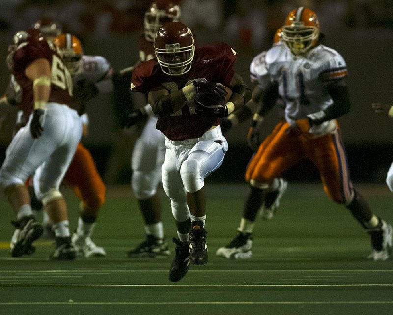 Running back Marius Johnson finds an opening against Florida during the 1995 SEC Championship Game at the Georgia Dome in Atlanta. Johnson finished with 71 yards rushing, but the Razorbacks couldn’t find the end zone in a 34-3 loss.