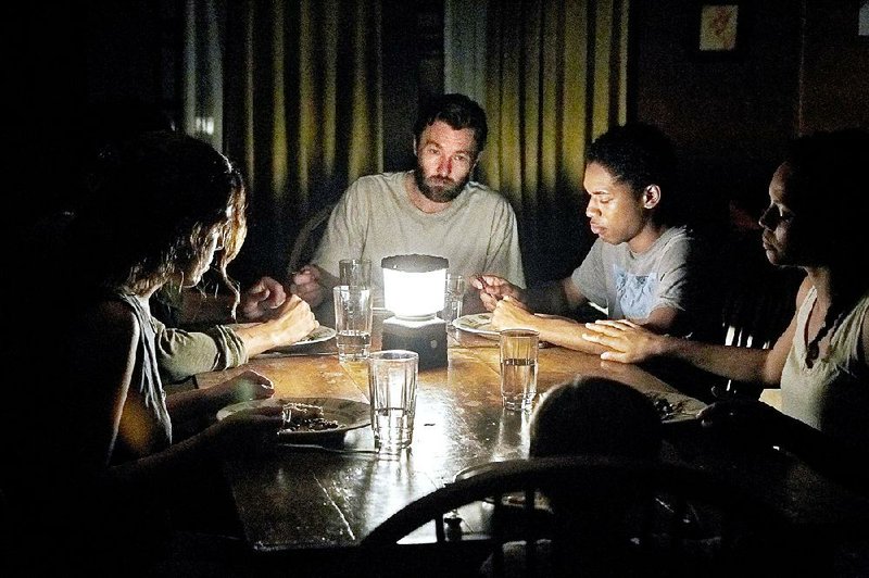 Kim (Riley Keough), Will (Christopher Abbott), Paul (Joel Edgerton), Travis (Kelvin Harrison Jr.) and Sarah (Carmen Ejogo) hole up in a remote cabin as an unnatural threat terrorizes the world in It Comes at Night.
