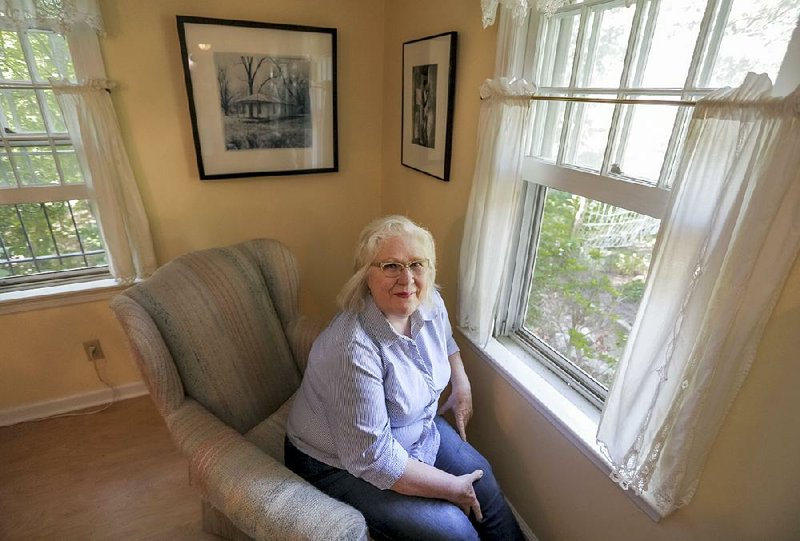 Beverly Buys is a photographer; her favorite space is sitting in the corner window of her living room.
