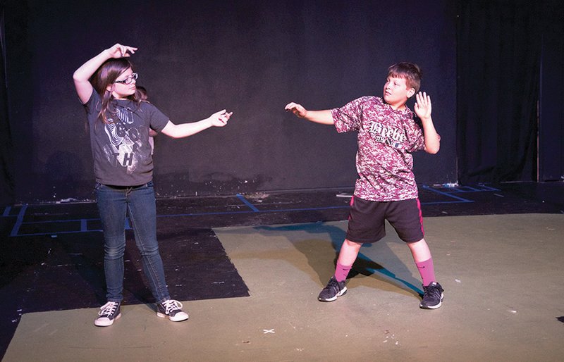 Lauryn Gray, 10, and Dylan Gray, 10, rehearse at Center on the Square in Searcy for a production of Into the Woods Jr., to be presented June 22-25. The musical is an intertwining of children’s fairy tales that will include singing, acting and dancing.