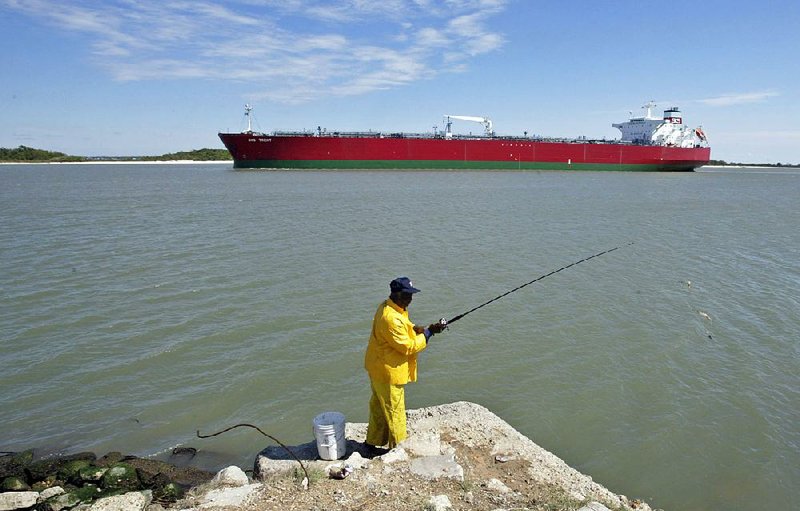 An oil tanker passes through the Houston Ship Channel near Morgan’s Point, Texas. The busy channel links the oil and gas fields of Texas and Louisiana to the rest of the world.
