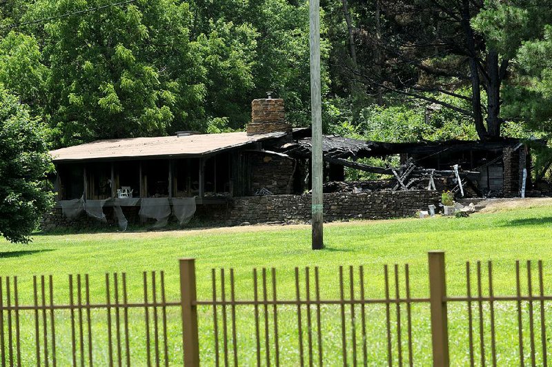 A fire early Thursday heavily damaged this Fay Jones-designed house at 6725 E. Huntsville Road in Fayetteville, where former President Bill Clinton lived from 1973 to 1975 while teaching at the University of Arkansas.