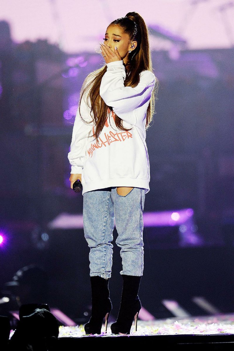 Singer Ariana Grande gets choked up at the One Love Manchester tribute concert. 