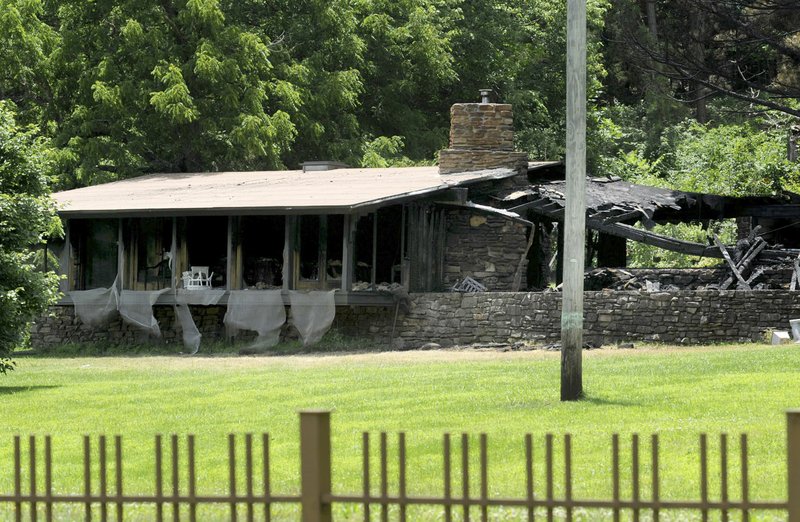 NWA Democrat-Gazette/ANDY SHUPE A Fay Jones-designed house at 6725 E. Huntsville Road in Fayetteville that burned early Thursday morning was once home to Bill Clinton.